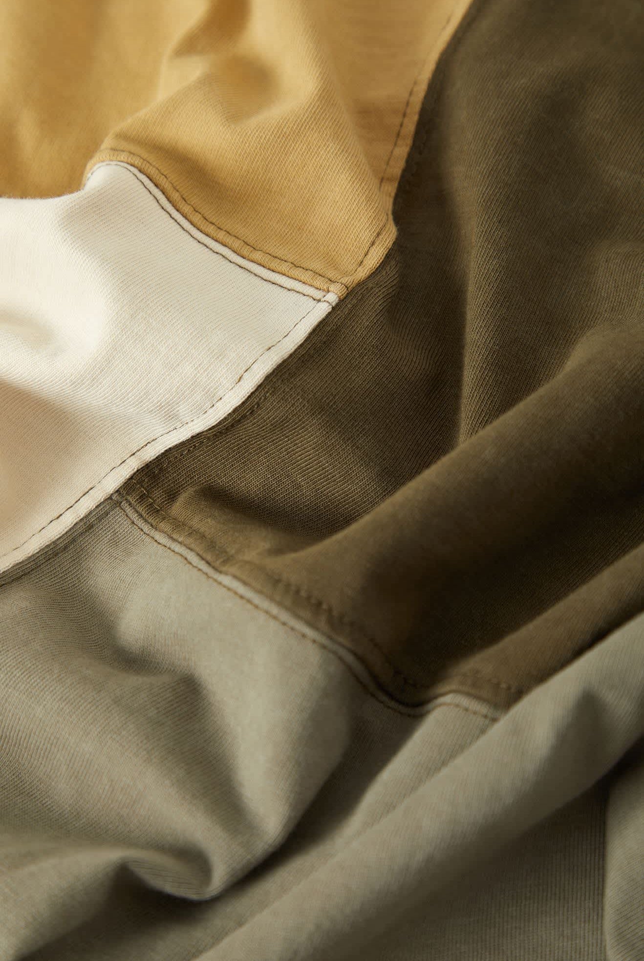 Men's Deco Relaxed Polo T-Shirt in the color Tonal Color Block - Additional Laydown image