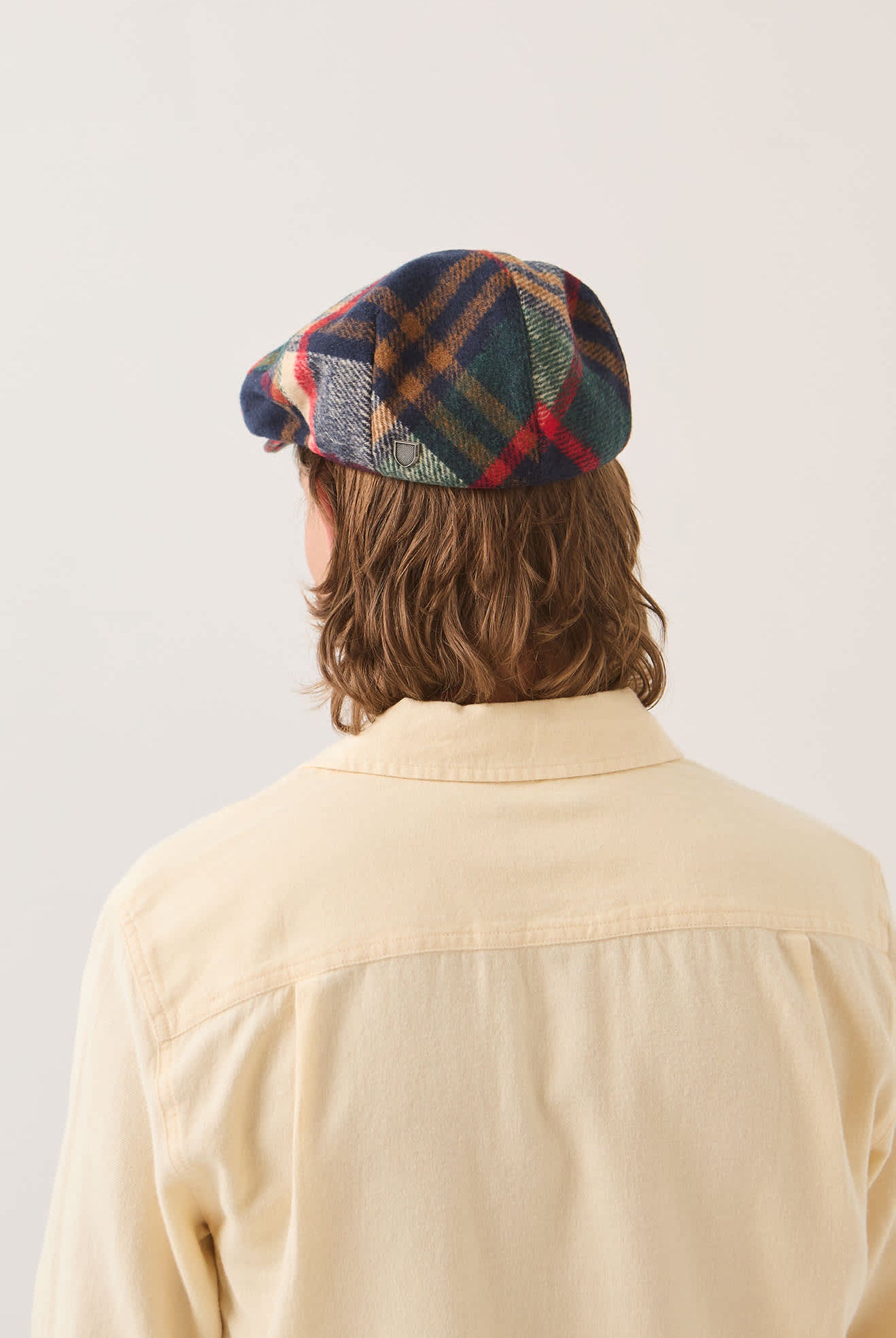 Unisex Hooligan Flat Cap in the color Navy/Green/Red/Cream - Men's Back View