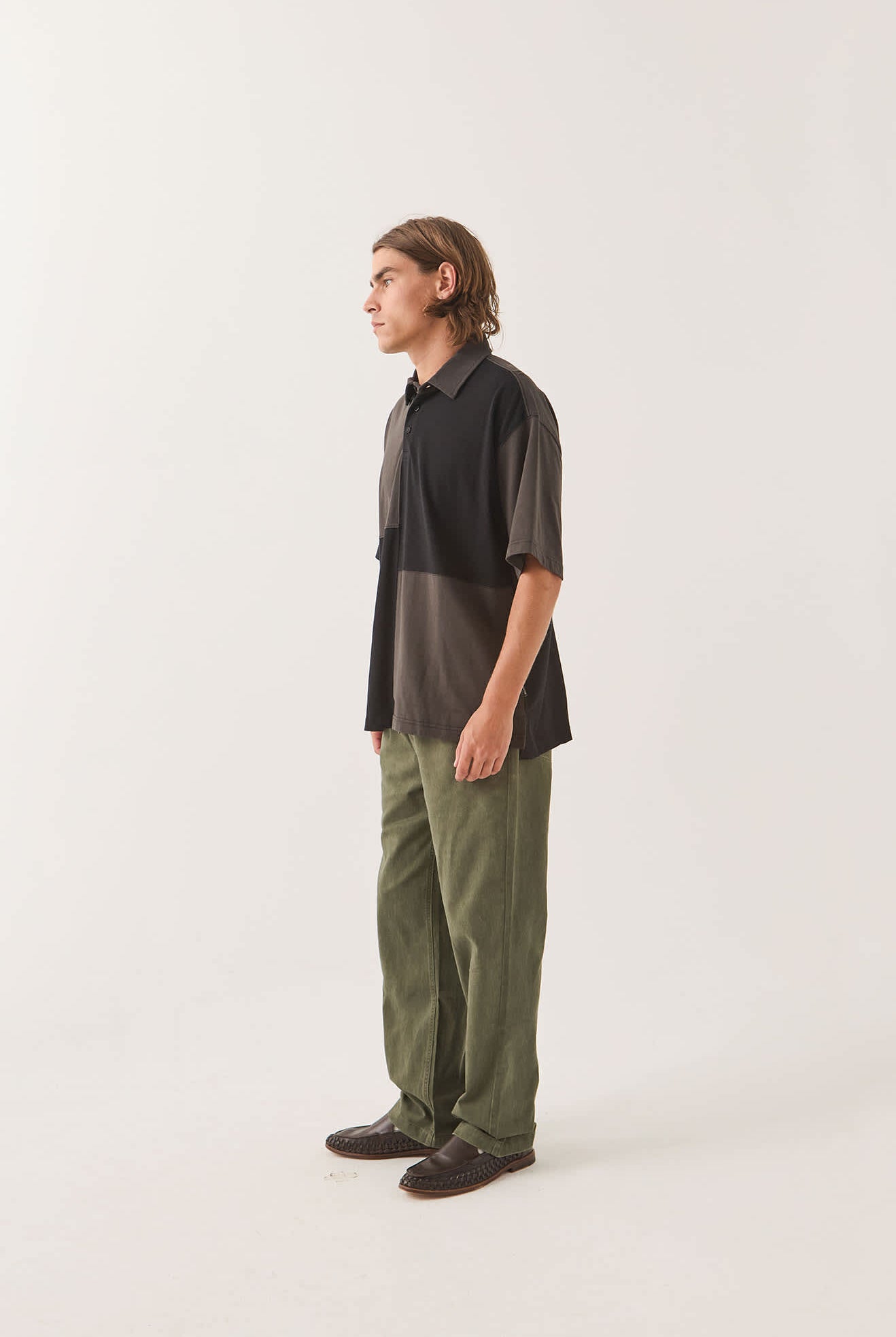 Men's Deco Relaxed Polo T-Shirt in the color Washed Black - Men's Side View