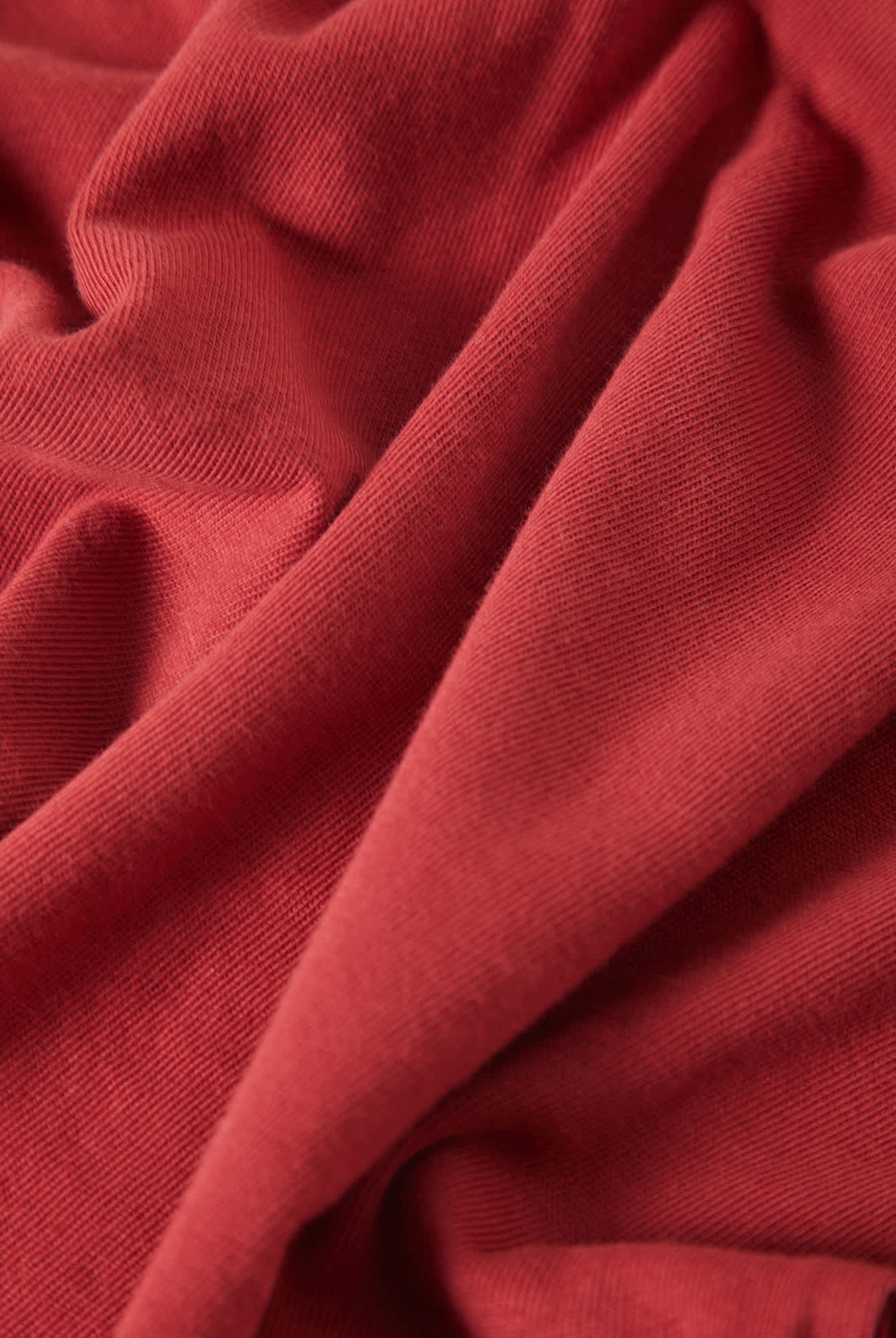 Women's Carefree Organic Garment Dye Cropped Tank in the color Robust Red - Additional Laydown image