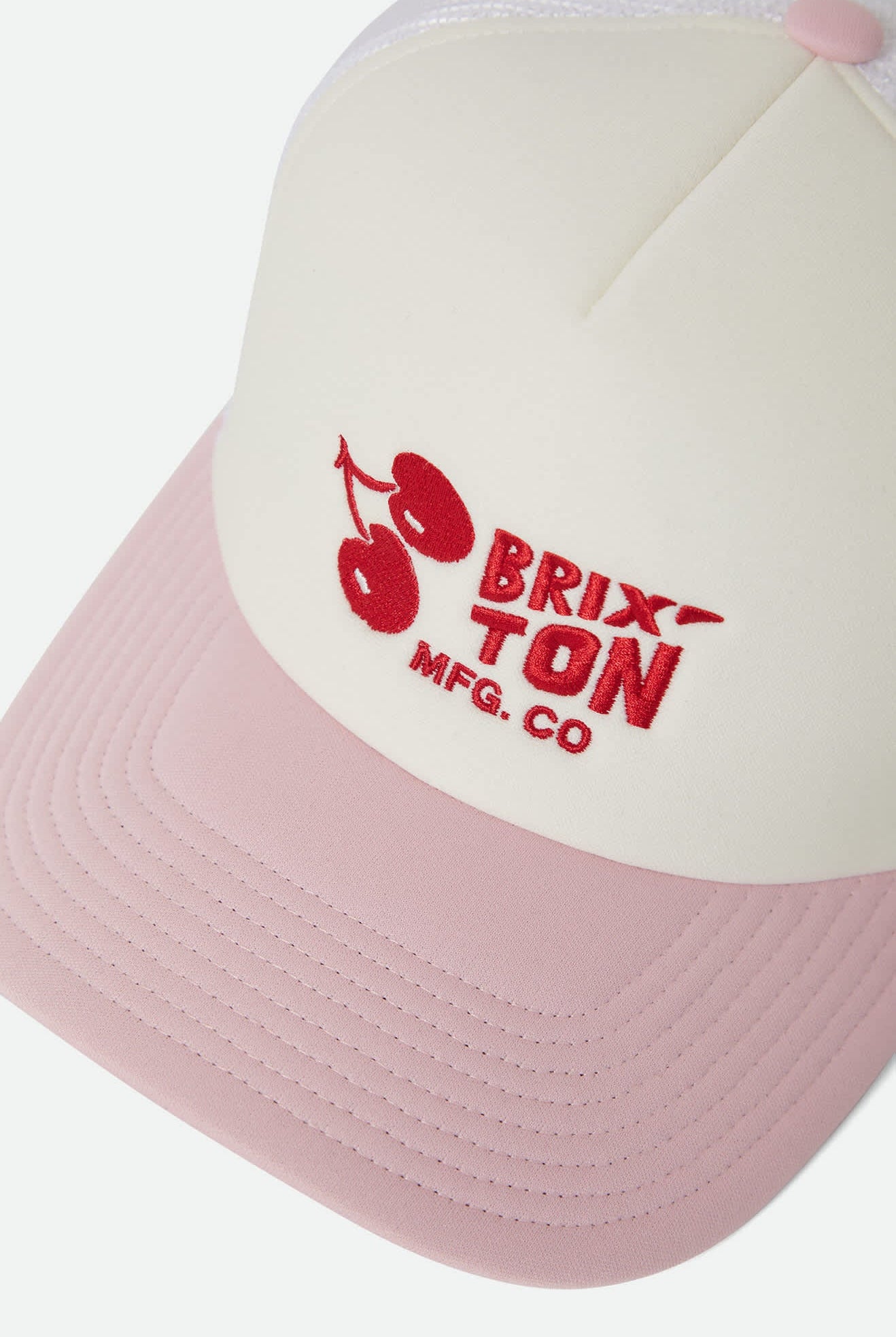Women's Cherry NetPlus Trucker Hat in the color Off White/Pink - Additional Laydown image