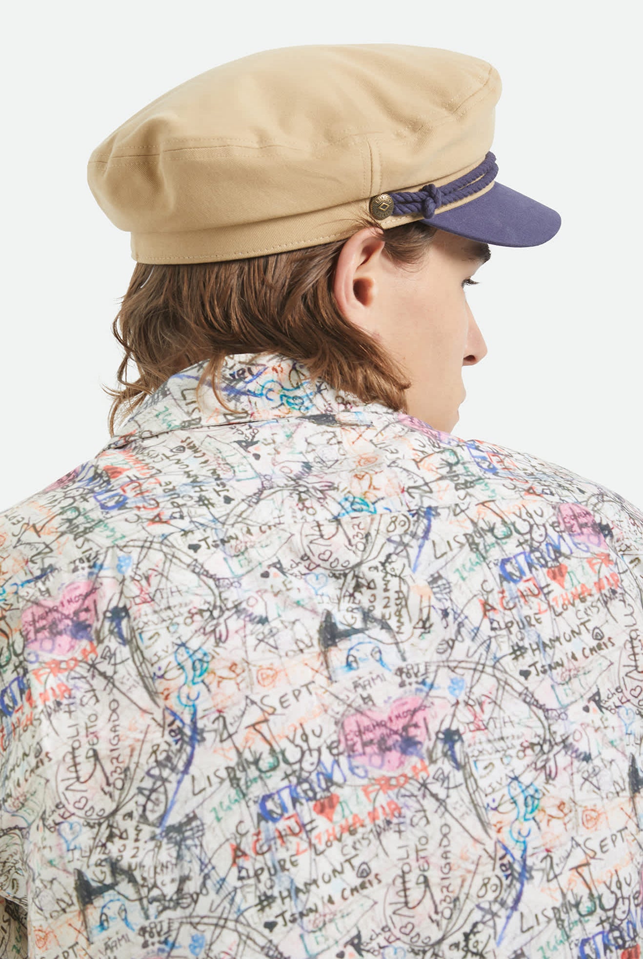 Unisex Fiddler Fisherman Cap in the color Sand/Washed Navy - Men's Back View