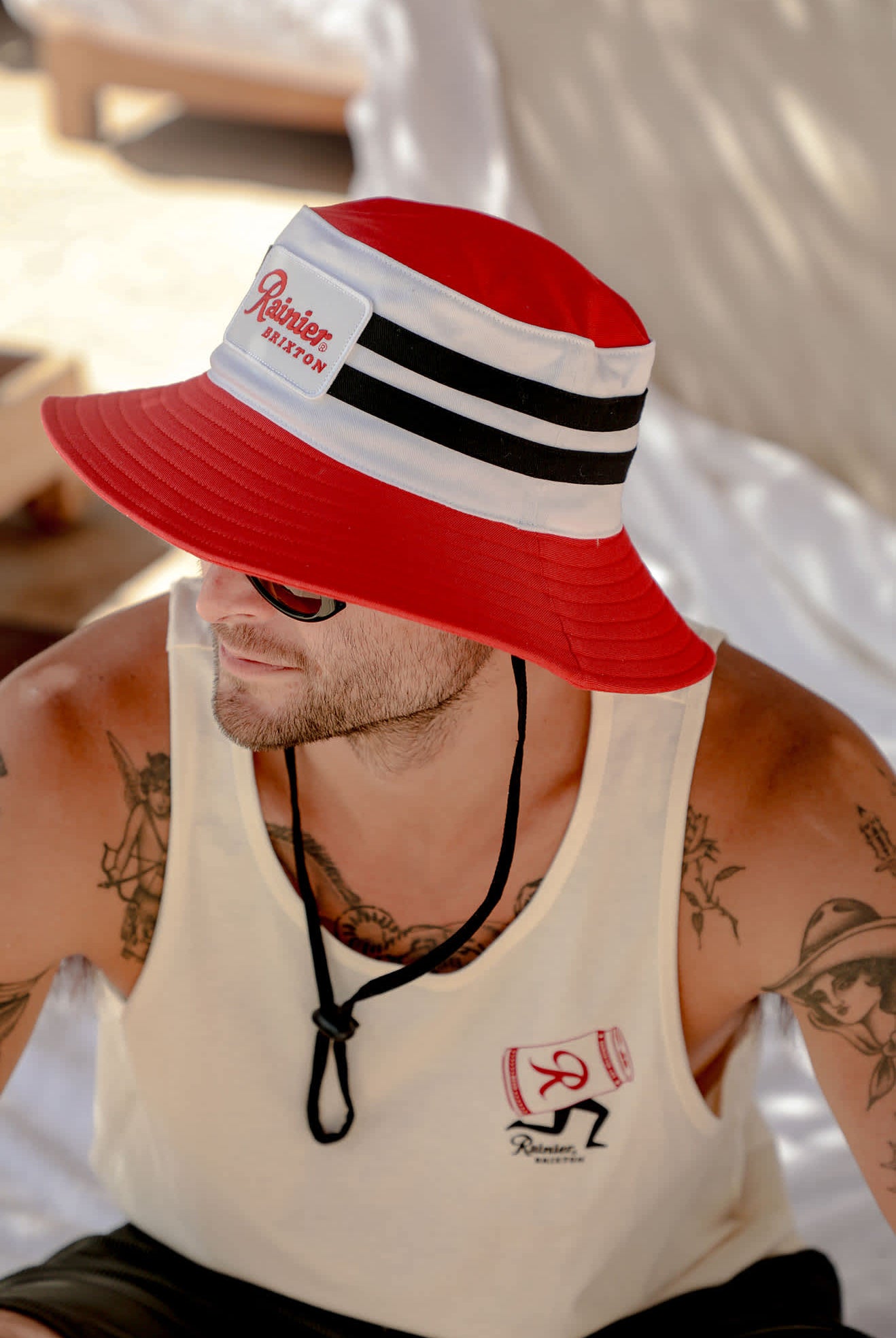 Unisex Rainier X Brixton Boonie in the color Natural/Red - Men's Lifestyle image