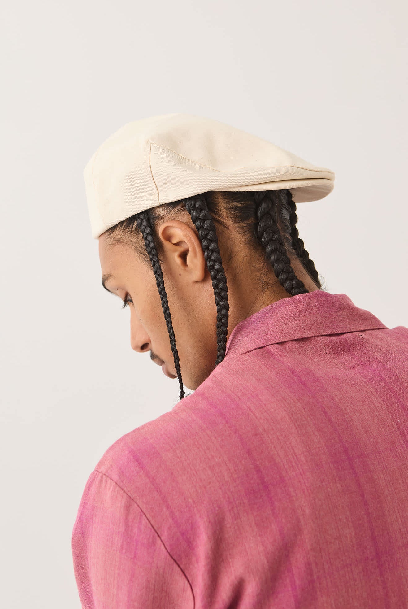 Unisex Hooligan Flat Cap in the color Egret White - Men's Side View