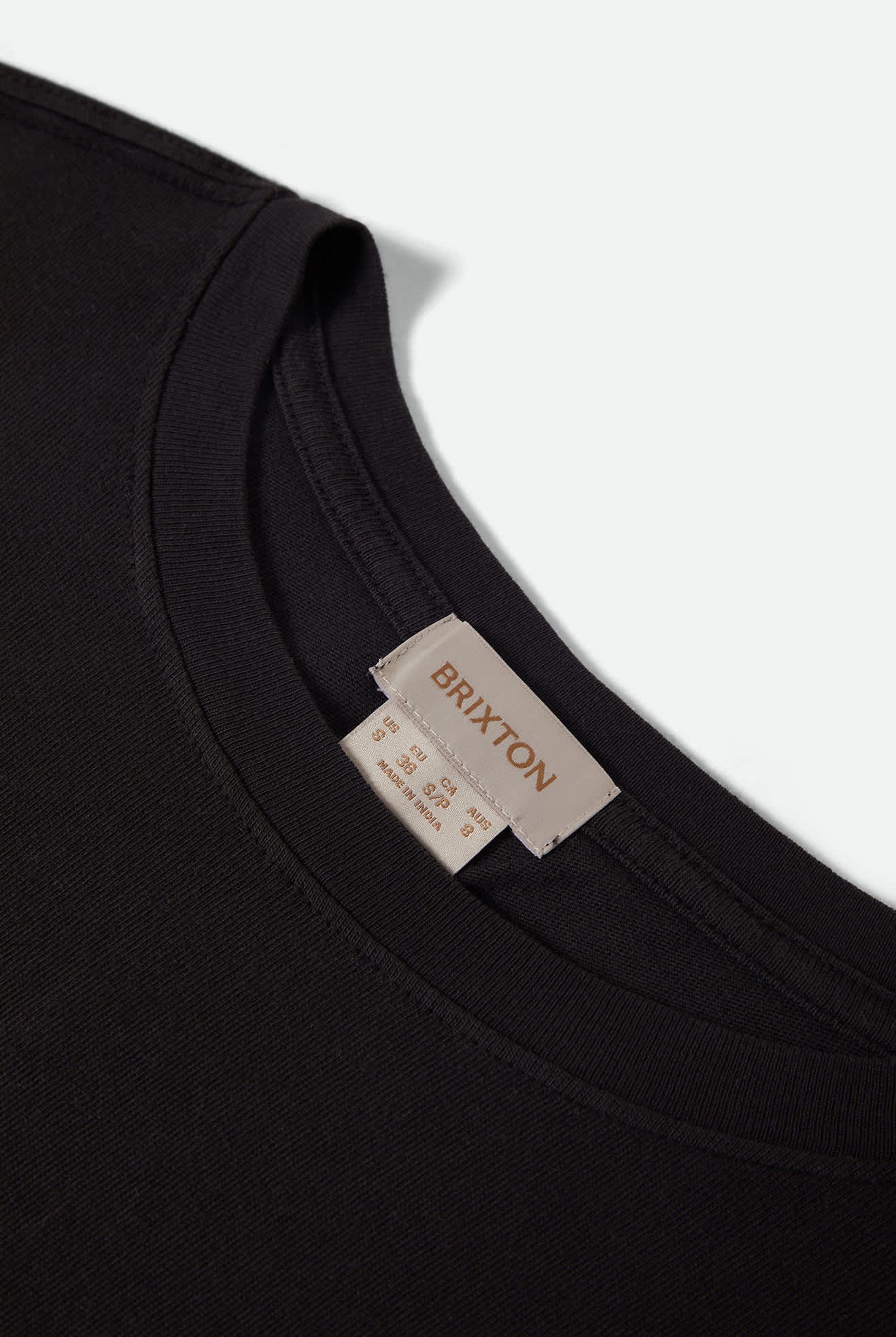 Women's Carefree Organic Garment Dye Cinch T-Shirt in the color Black - Additional Laydown image