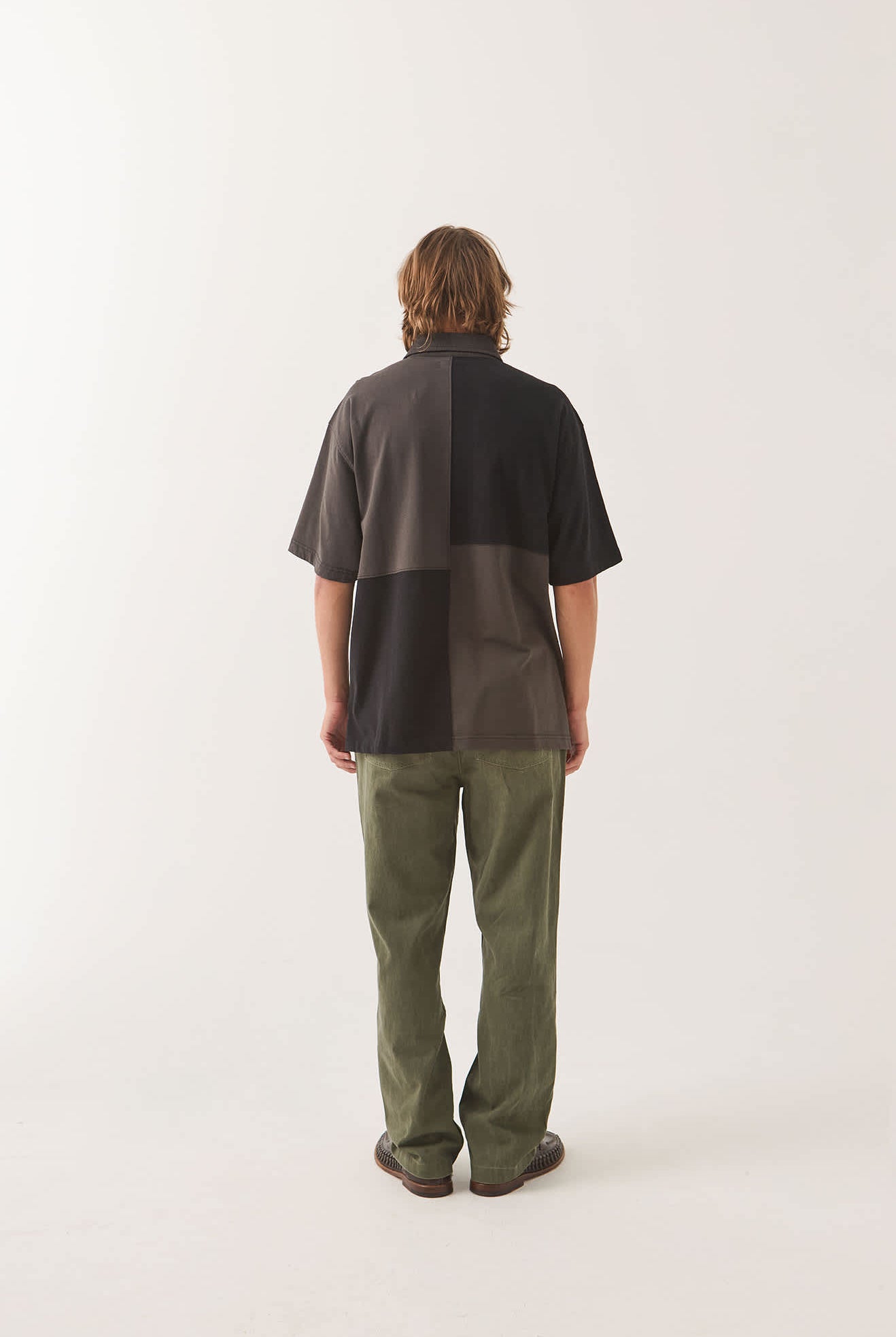 Men's Deco Relaxed Polo T-Shirt in the color Washed Black - Men's Back View