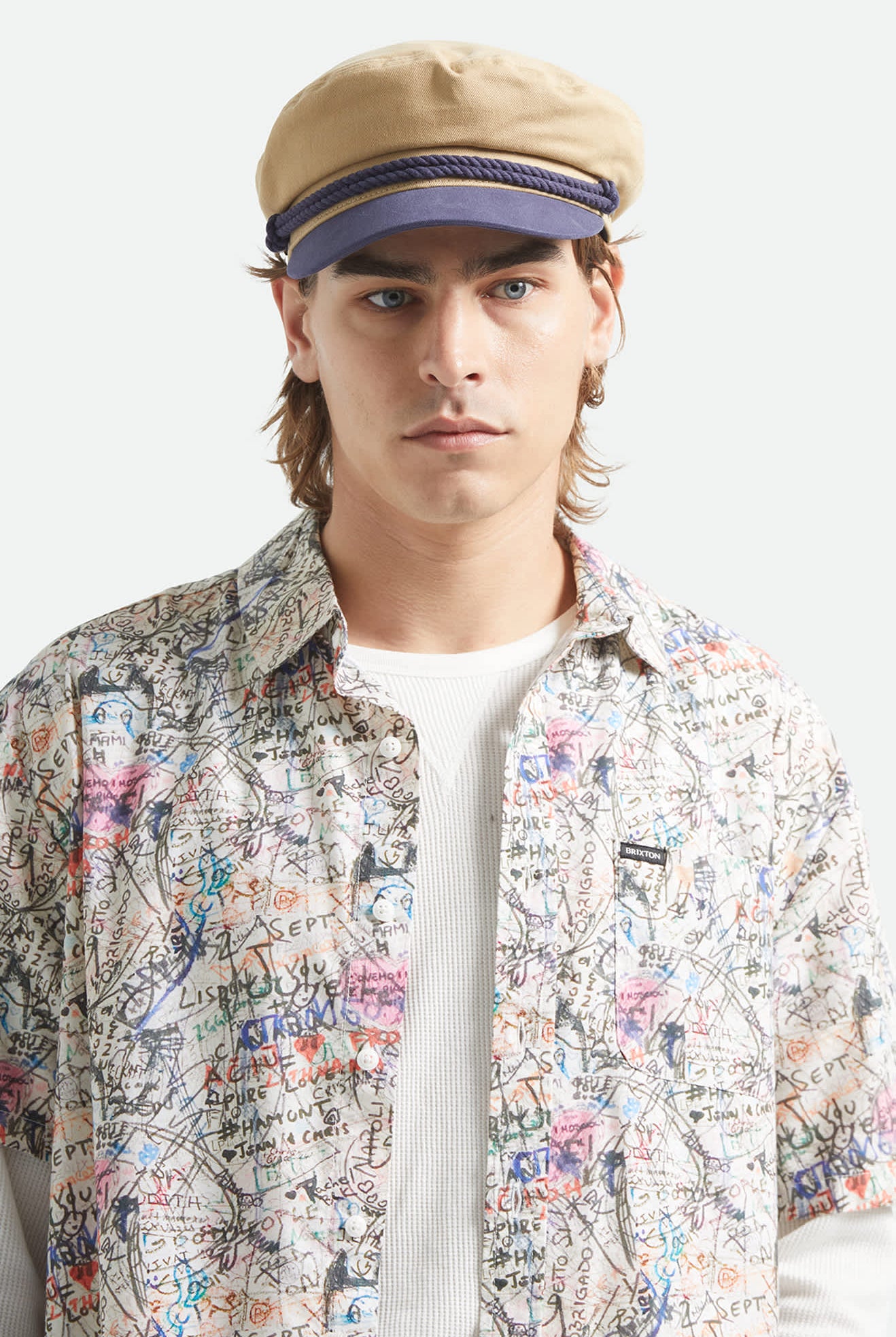 Unisex Fiddler Fisherman Cap in the color Sand/Washed Navy - Men's Front View