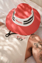 Unisex Rainier X Brixton Boonie in the color Natural/Red - Men's Lifestyle image