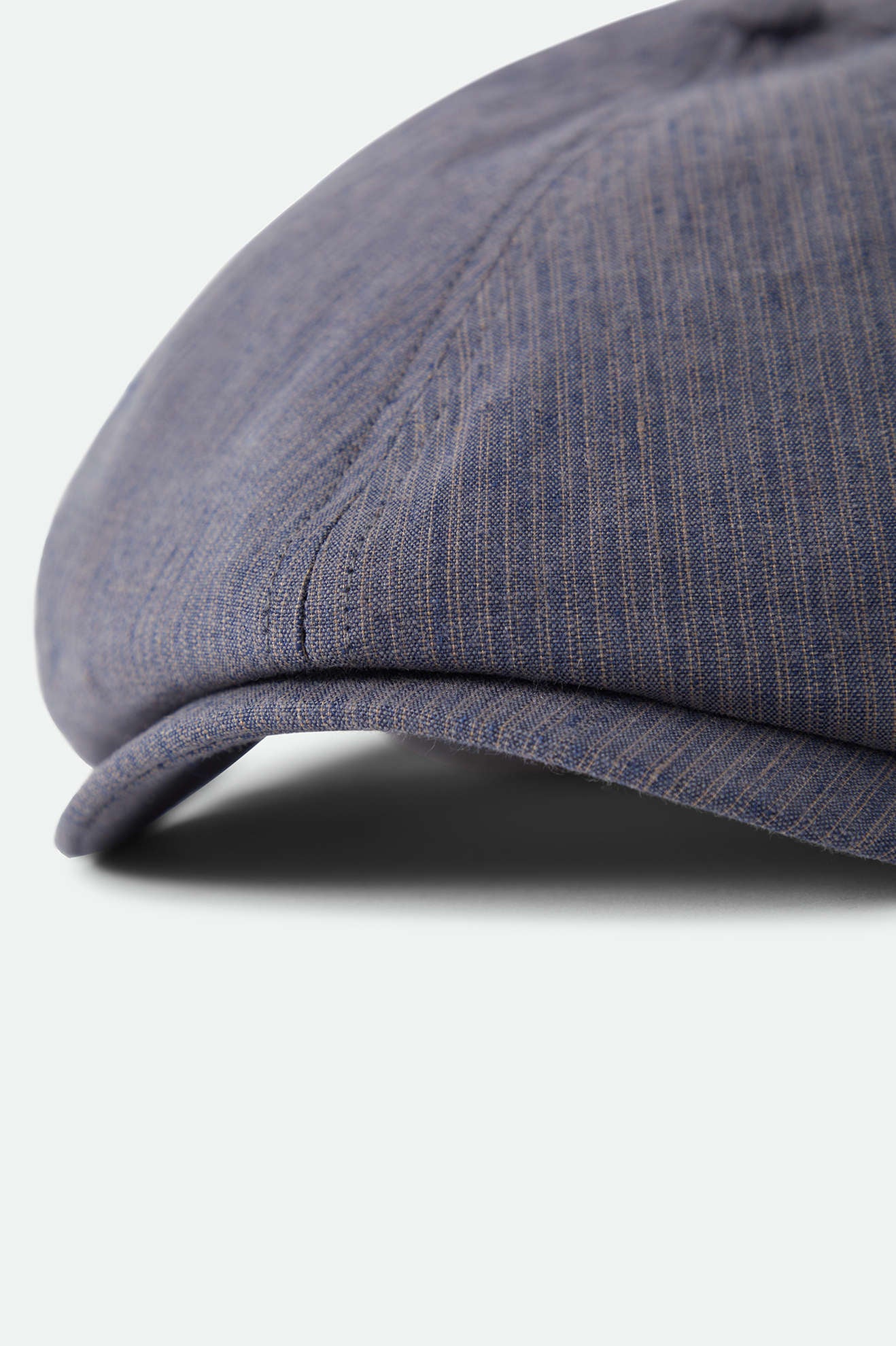 Unisex Brood Newsboy Cap in the color Indigo/Dark Sand - Additional Laydown image