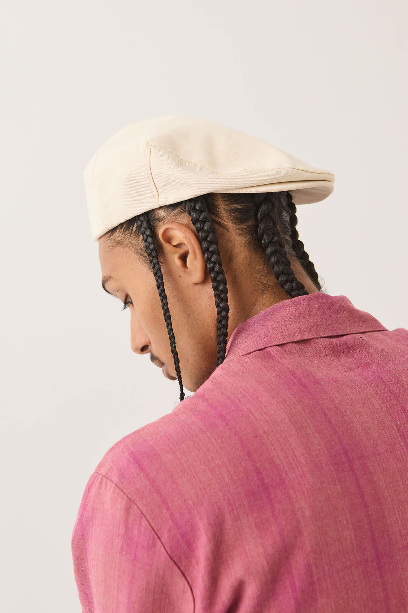 Unisex Hooligan Flat Cap in the color Egret White - Men's Side View