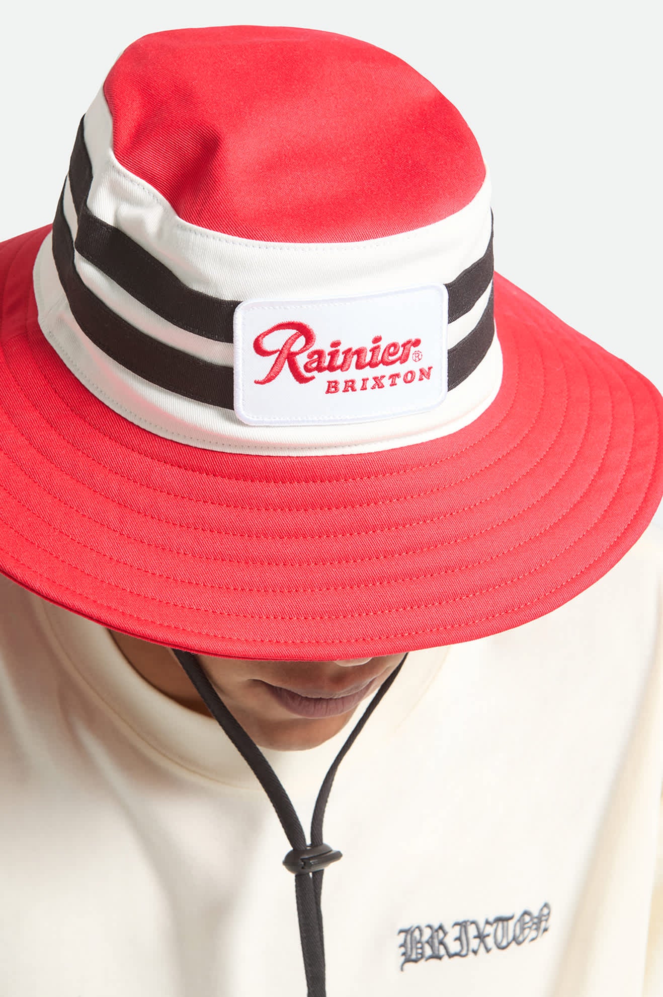 Unisex Rainier X Brixton Boonie in the color Natural/Red - Additional Fit image