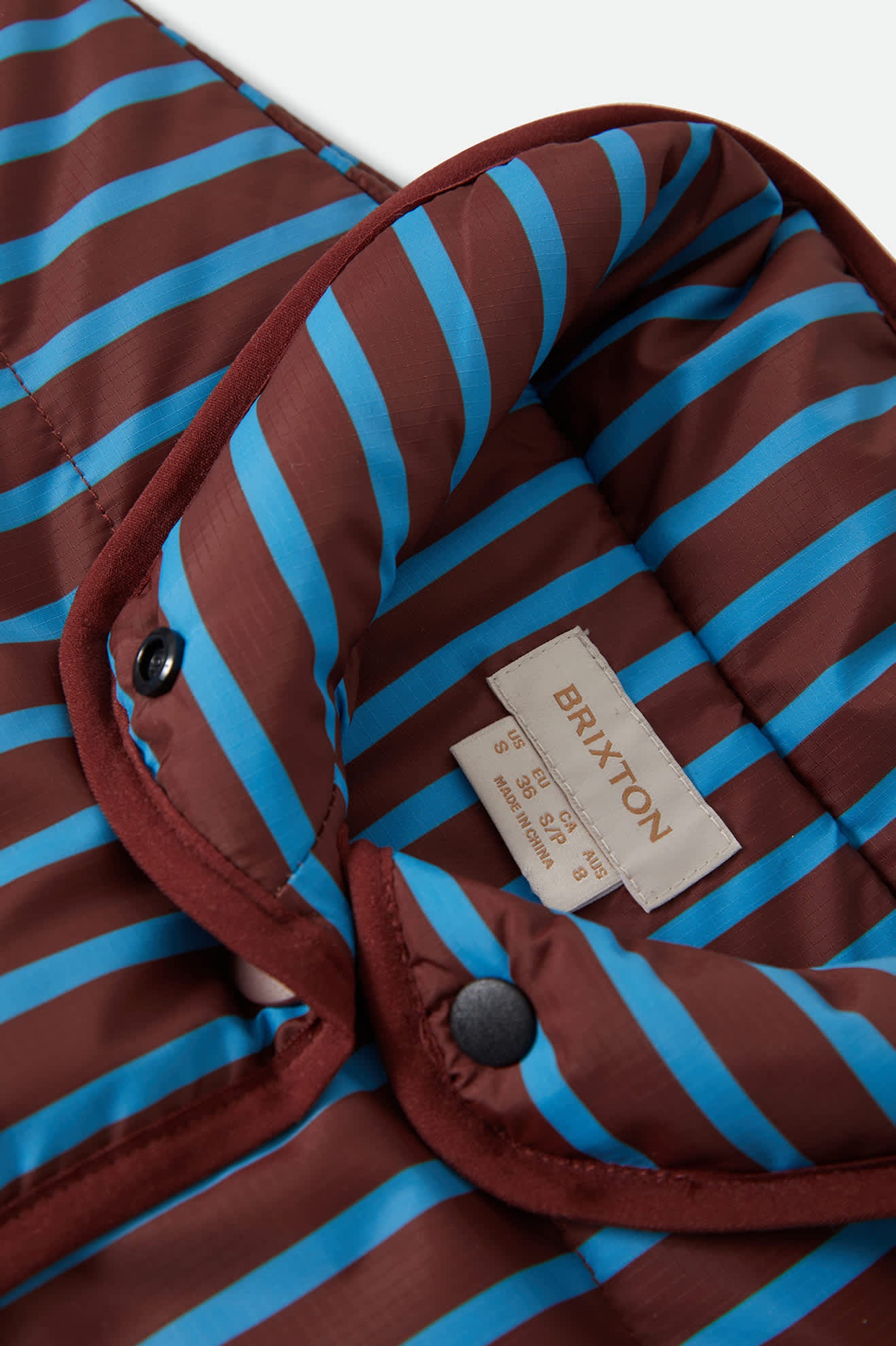 Women's Delilah Mock Neck Jacket in the color Dark Brick/Electric Indigo Stripe - Additional Laydown image